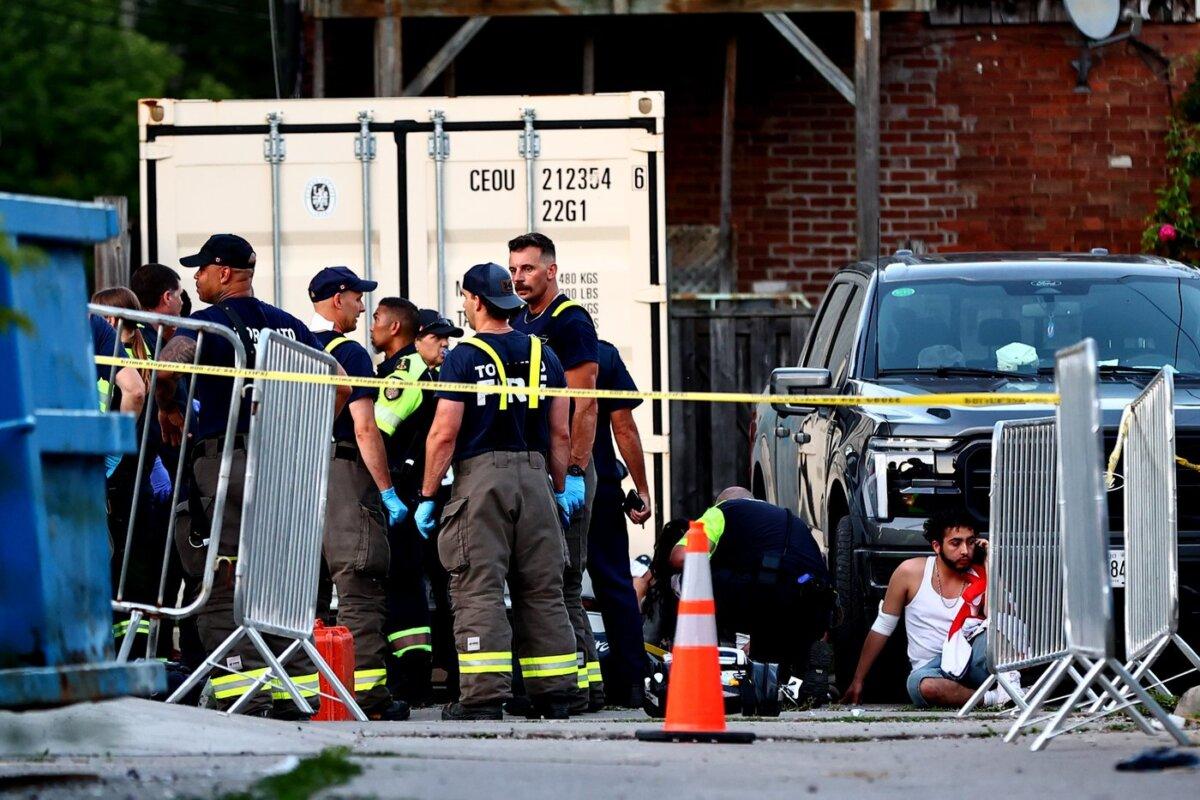 Paramedics respond to an active shooter at the Salsa on St. Clair event in Toronto, on July 11, 2026. (The Canadian Press/Keito Newman)