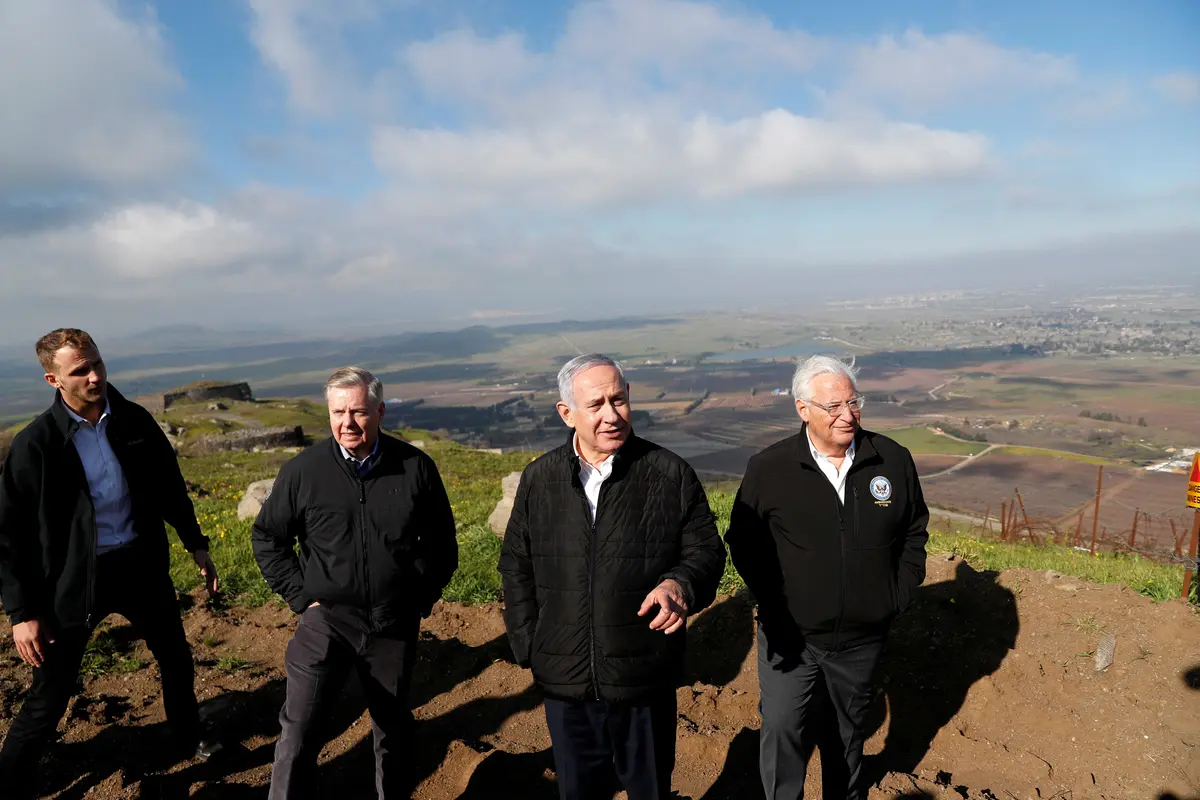 Israeli Prime Minister Benjamin Netanyahu, U.S. Sen. Lindsey Graham (R-S.C.), and U.S. Ambassador to Israel David Friedman visit the border line between Israel and Syria at the Golan Heights on March 11, 2019. (Ronen Zvulun/Reuters/File Photo)