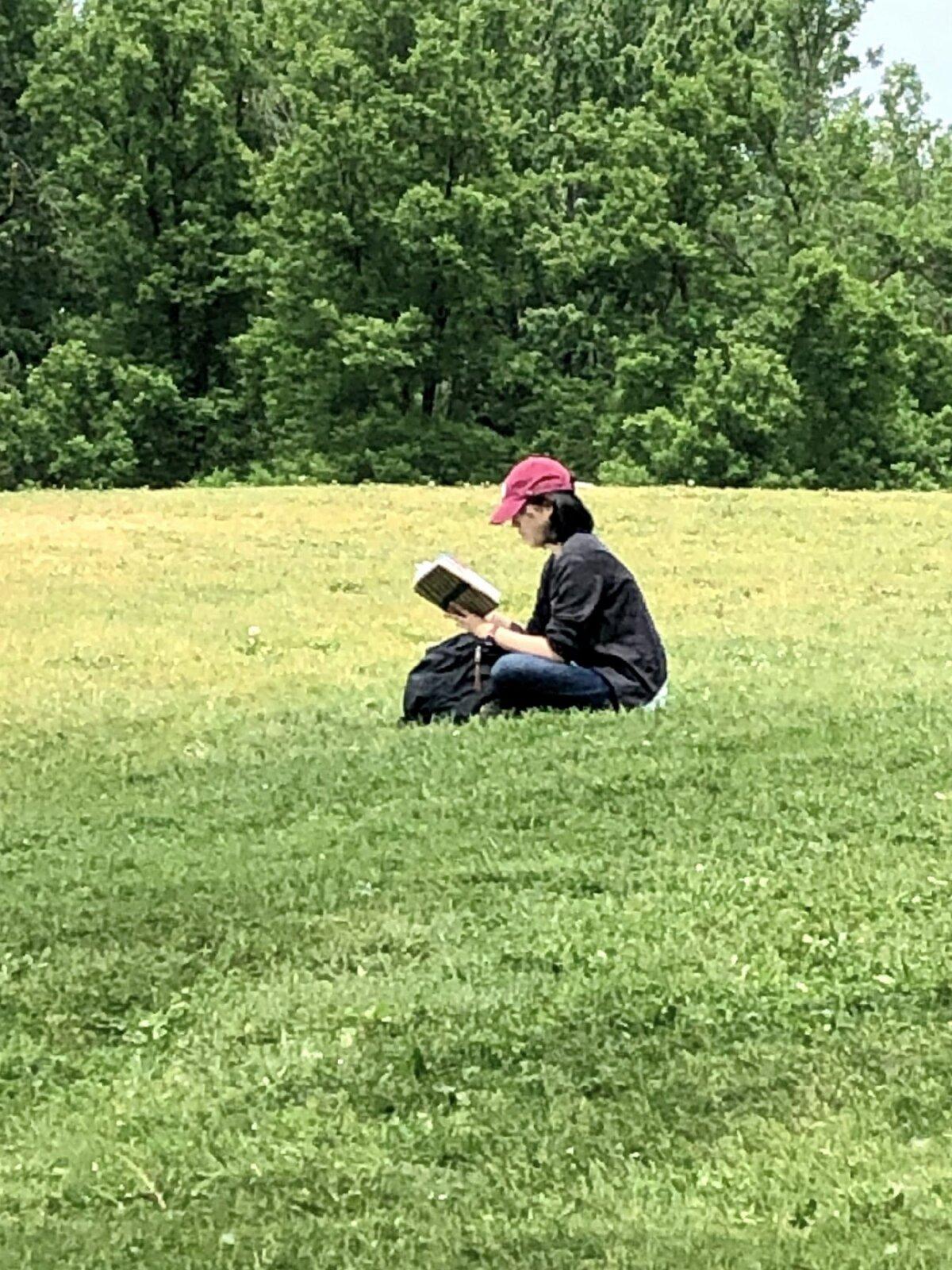 A woman finds a quiet place to read in Montreal's Mount Royal Park. (Photo courtesy of Cheryl Thiede)