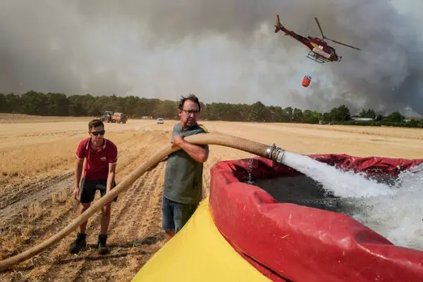 Day in Photos: Wildfire in France, Anti-Ballistic Missile Meeting, and Grand Prix Car Race