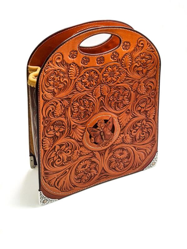 Floral carved leather tote, 2009, by Cary Schwarz. Leather, (silver and gold by Scott Hardy); 14 inches by 10 inches by 5 inches. (Madison Metro/Courtesy of Craft in America)