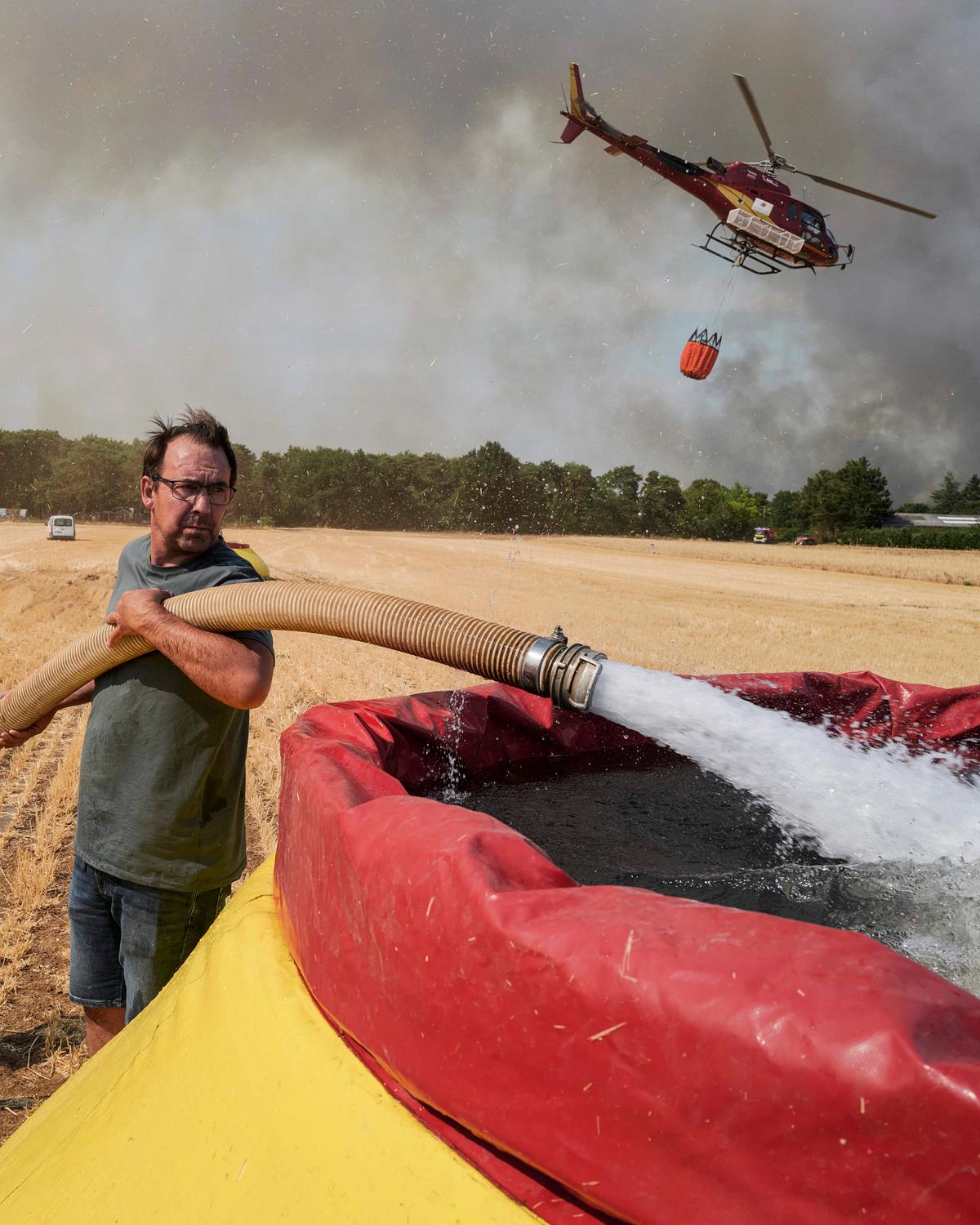 Day in Photos: Wildfire in France, Anti-Ballistic Missile Meeting, and Grand Prix Car Race