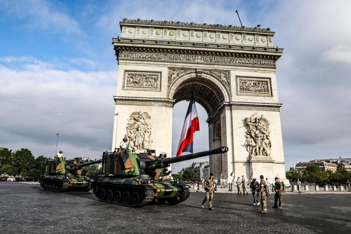 French tanks gather in front of the Arc de Triomphe on the Champs-Élysées Avenue in Paris prior to the Bastille Day military parade, on July 14, 2019. (Photo by Ludovic Marin / via Getty Images)