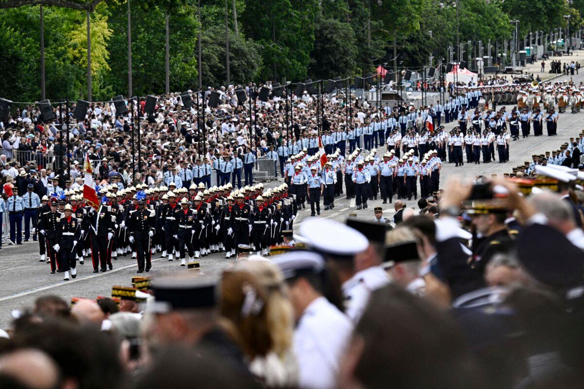 French troops take part in the Bastille Day military parade along the Avenue Foch with the Arc de Triomphe in the background in Paris, on July 14, 2024. (Julien de Rosa / AFP via Getty Images)