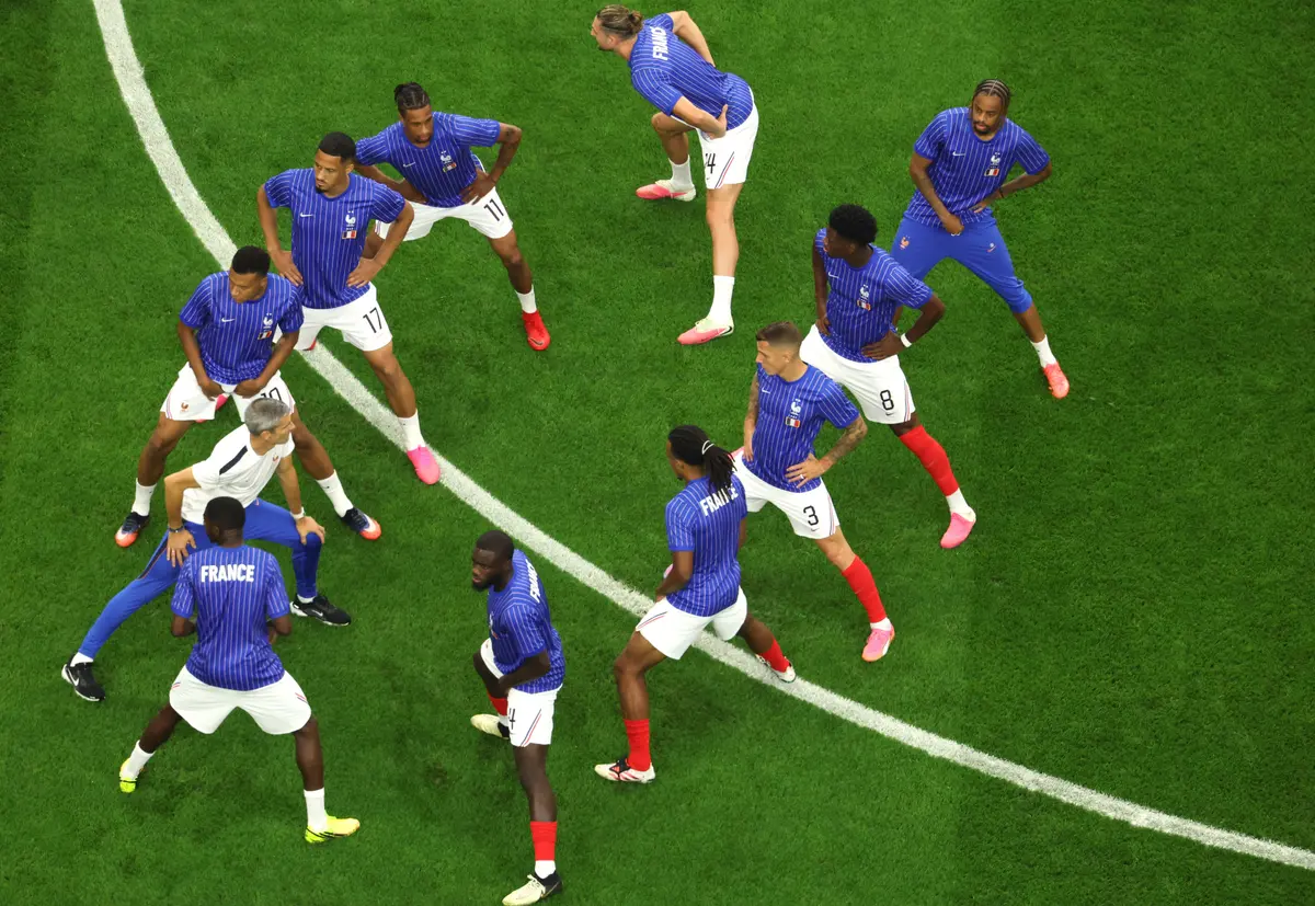 The French team warms up ahead of the 2026 World Cup football tournament semifinal match against Spain at the Dallas Stadium in Arlington on July 14, 2026. (Odd Andersen / AFP via Getty Images)
