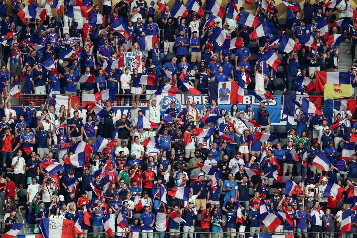 France supporters cheer their team on from the stands ahead of the 2026 World Cup football semifinal match between France and Spain at the Dallas Stadium in Arlington on July 14, 2026. (Aric Becker / AFP via Getty Images)