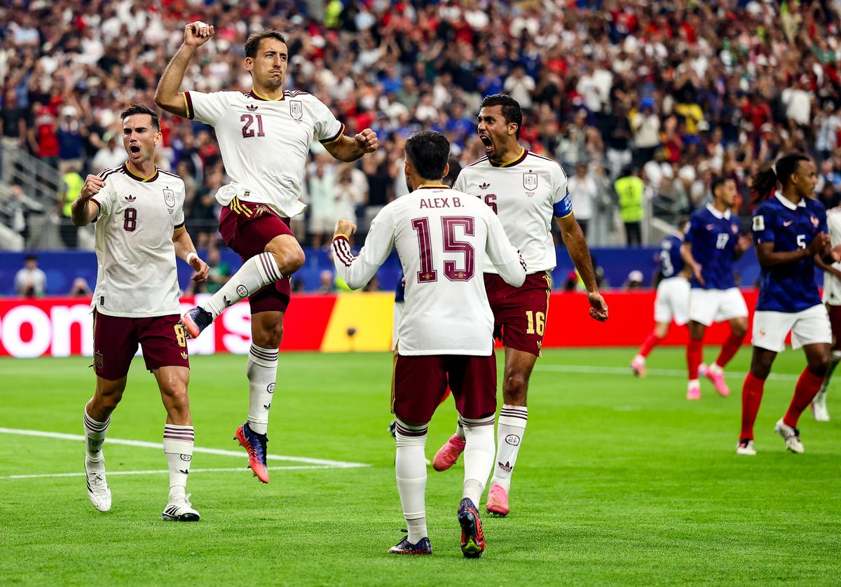 Mikel Oyarzabal #21 of Spain celebrates with teammates after converting a penalty to score the team's first goal during the FIFA World Cup 2026 Semifinal match between France and Spain at Dallas Stadium on July 14, 2026. (Lars Baron/Getty Images)
