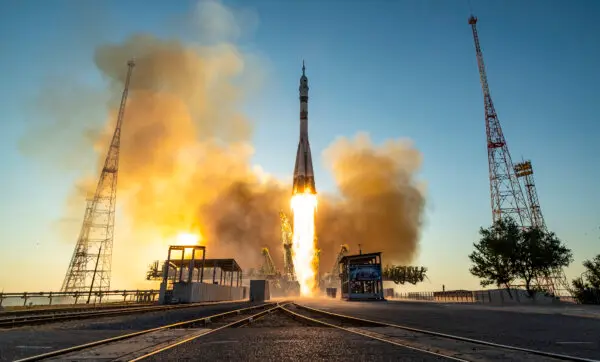 Day in Photos: Soyuz ISS Launch, France Bastille Day Parade, and Van Collision in Chile