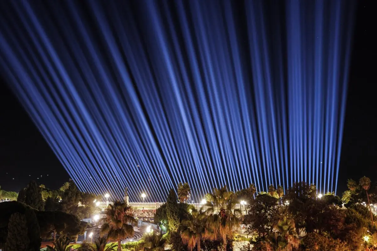 This photograph shows 86 beams of light representing the victims at the end of a ceremony marking the 10th anniversary of the July 14, 2016 attack, which killed 86 people and injured more than 400, in the French Riviera city of Nice on July 14, 2026. (Valery Hache/AFP via Getty Images)