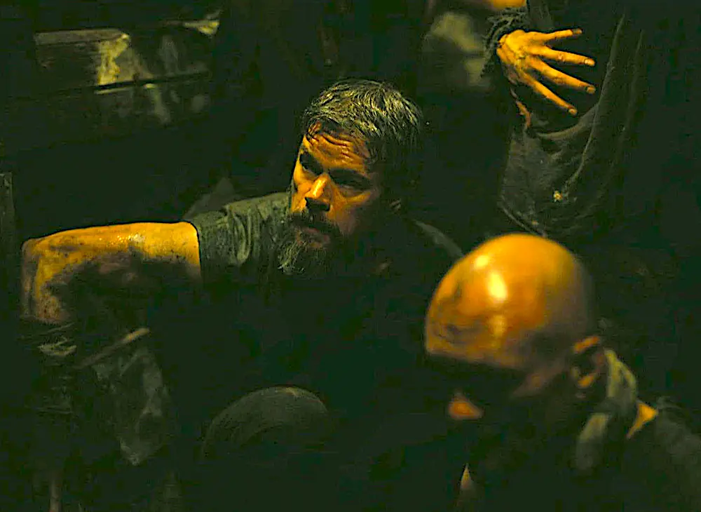 Odysseus (Matt Damon, center) in the belly of the beast, in "The Odyssey." (Universal Pictures)