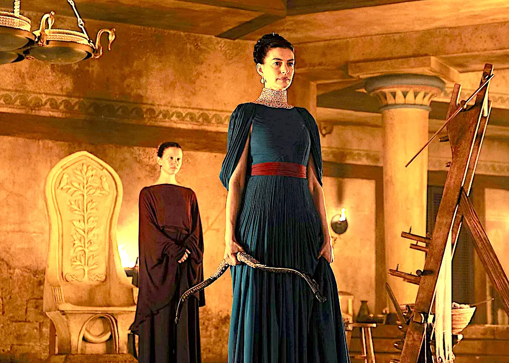 Odysseus’s wife Penelope (Anne Hathaway, center) declares she will marry the suitor who can string the bow of her husband, in "The Odyssey." (Universal Pictures)