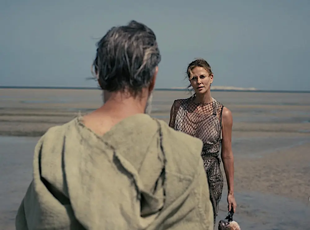 Odysseus (Matt Damon) has woken up from the spell of Calypso (Charlize Theron) and wants to go home, in "The Odyssey." (Universal Pictures)