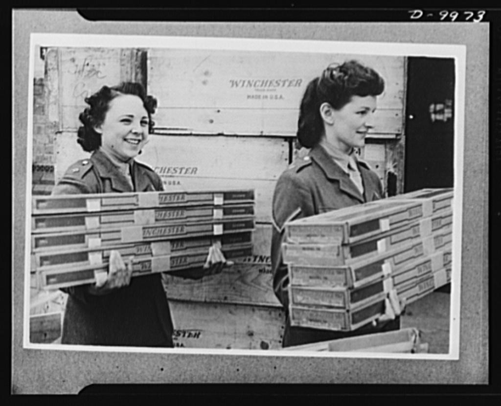Lend-Lease to Britain. English girls, members of the Auxiliary Territorial Service move armfuls of American rifles just arrived from the United States under lend-lease. Library of Congress. (Public Domain)