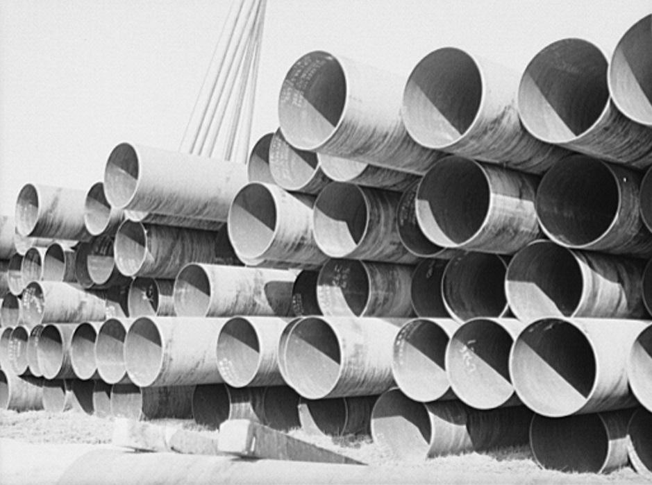 These 24-inch Big Inch pipes delivered by rail in February 1943. Library of Congress.. (Public Domain)