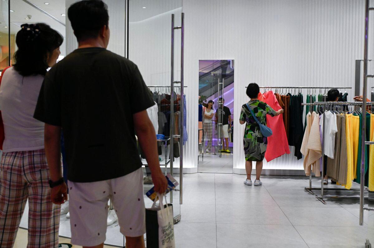 A woman browses in a mall in Beijing on July 15, 2026. (Wang Zhao/AFP via Getty Images)