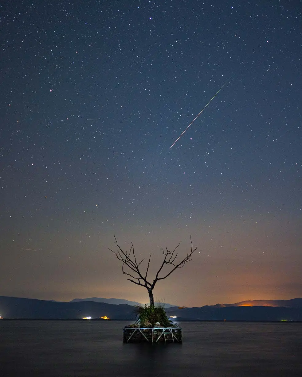 Macedonian photographer Riste Spiroski chose the ancient Lake Ohrid as the foreground for this shot of a Perseid meteor captured in 2024. (Courtesy of Riste Spiroski)
