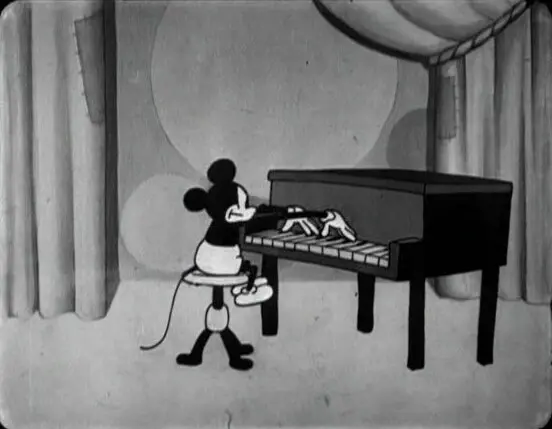 Screenshot from the cartoon "The Opry House" (1929), with Mickey Mouse playing Prelude in C-sharp Minor. (Public Domain)