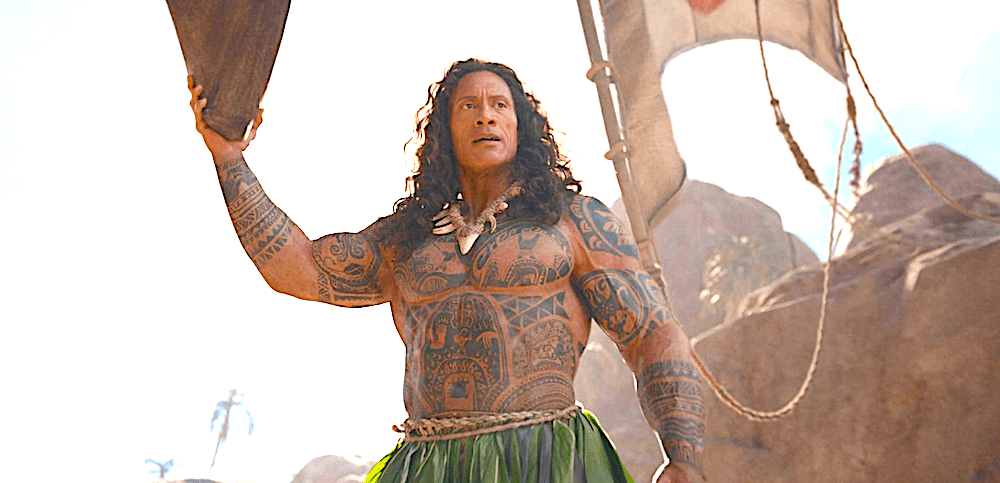 Demi-god Maui (Dwayne Johnson) holds Moana's entire raft in one hand, in "Moana." (Disney)