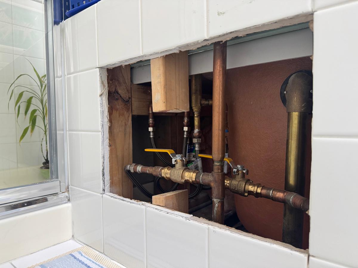 A Clever Plumbing Access Panel Solution