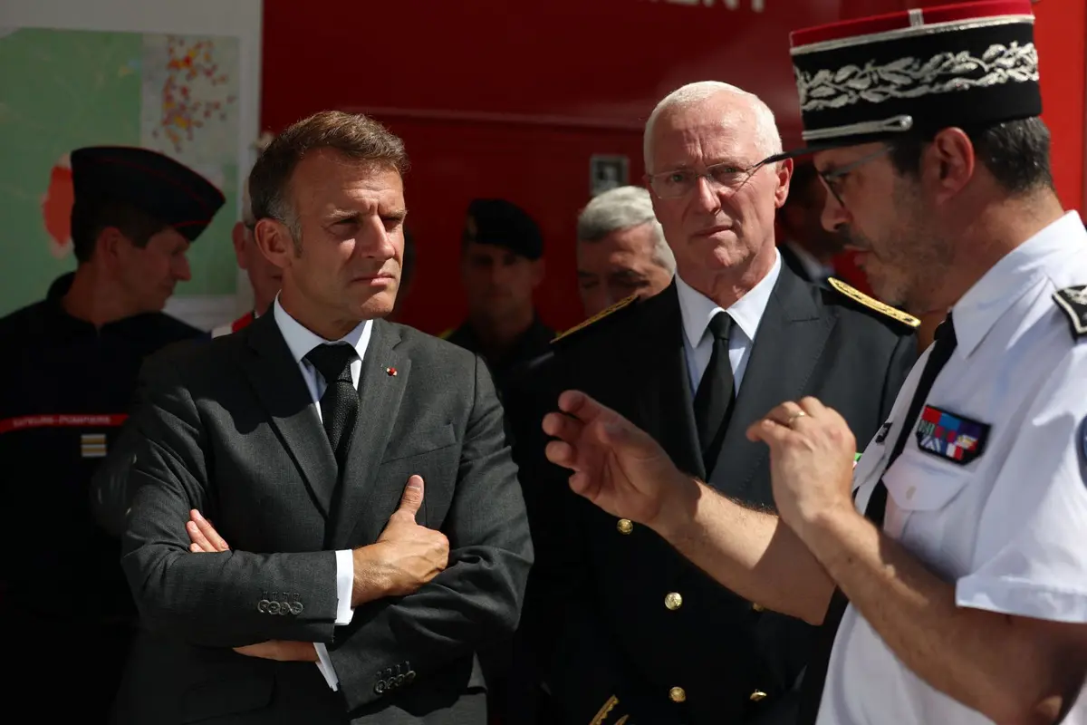 French President Emmanuel Macron (L) and Seine-et-Marne prefect Pierre Ory (C) visit the firefighters' central command site following a fire in the Fontainebleau Forest, in Noisy-sur-École, in Paris' Ile-de-France region on July 16, 2026. (Mohammed Badra/AFP via Getty Images)