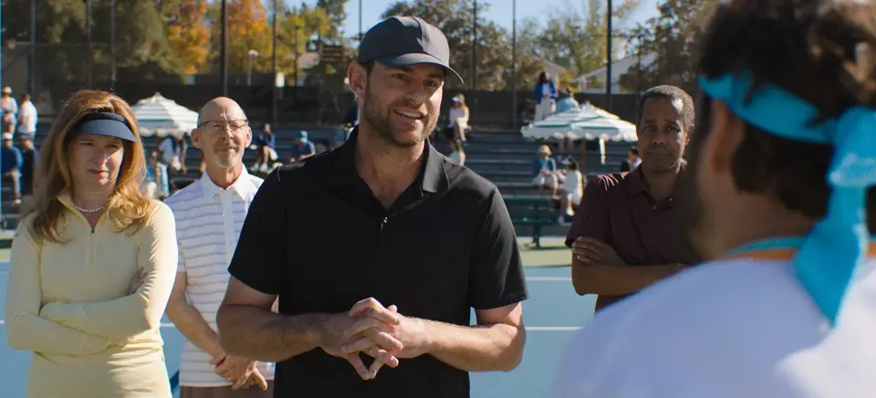 Andy Roddick (C) plays himself in an extended cameo, in "The Dink." (Apple Original Films)