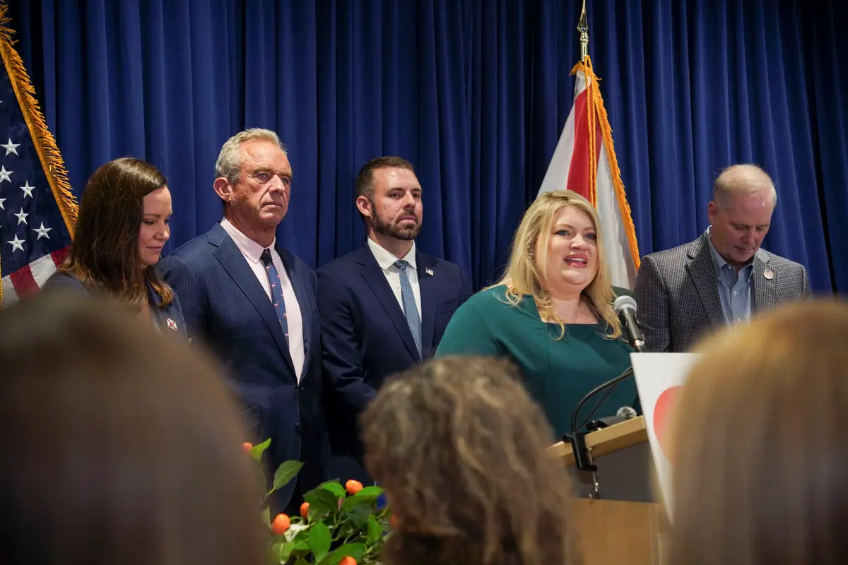 From left to right, Sen. Ashley Moody (R-Fla.), Health and Human Services Secretary Robert F. Kennedy Jr., Acting Food and Drug Administration (FDA) Commissioner Kyle Diamantas, Rep. Kat Cammack (R-Fla.), and Florida Commissioner of Agriculture Wilton Simpson speak at a press conference announcing an FDA rule change for pasteurized orange juice sugar content in Lakeland, Fla., on July 17, 2026. (Jacob Burg/The Epoch Times)