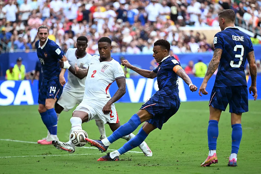 England's defender Ezri Konsa and France's forward Kylian Mbappe fight for the ball during the 2026 World Cup football tournament third-place match between France and England at the Miami Stadium in Miami on July 18, 2026. (Chandan Khanna / AFP via Getty Images)