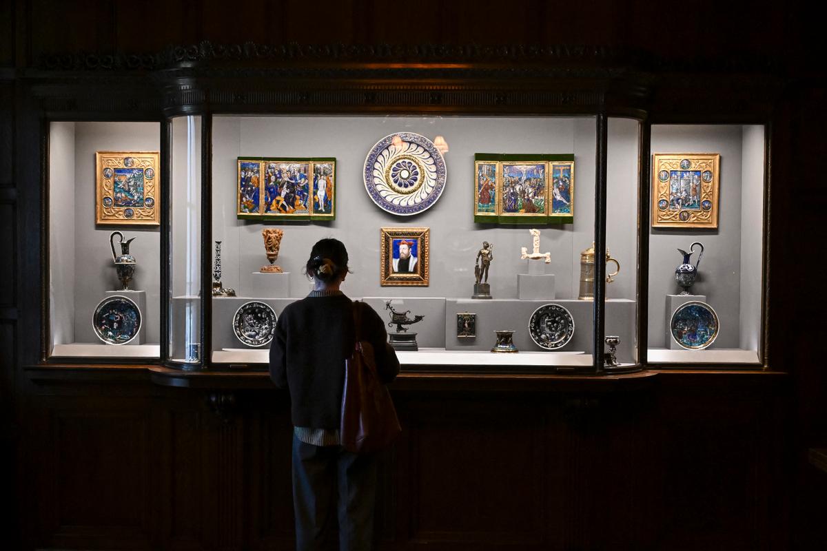 A woman looks at art in the Enamels Room during The Frick Collection press preview in New York City on March 25, 2025. (Angela Weiss/AFP via Getty Images)