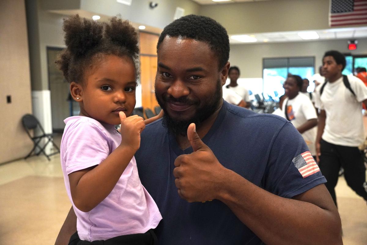 Lando Will and his younger daughter at the Orange County HBCU Information Session in Wallkill, N.Y., on July 18, 2026. (Oliver Mantyk/The Epoch Times)