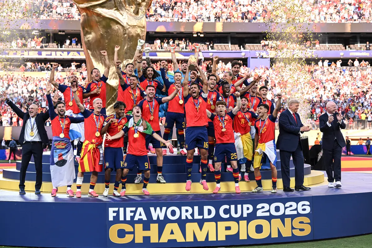 Spain captain Rodri lifts the World Cup trophy alongside President Donald Trump and FIFA President Gianni Infantino after the team’s victory against Argentina at New York New Jersey Stadium in East Rutherford, New Jersey, on July 19, 2026. (David Ramos/Getty Images)