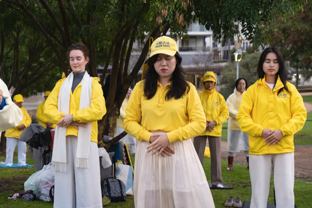 Young practitioners perform peaceful Falun Dafa meditation exercises ahead of the July 20 global appeal in front of the Chinese Communist Party's consulate in Perth on July 17, 2026. Falun Dafa is an ancient meditation practice rooted in the principles of Truthfulness, Compassion, and Forbearance. (Wade Zhong/The Epoch Times)