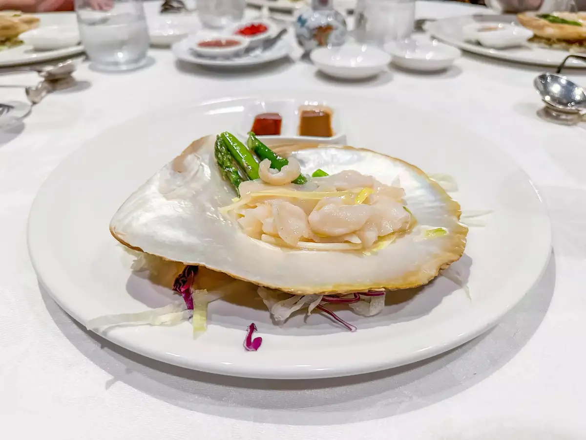 At Cantonese institution Flower Drum, a serving of pearl meat, the delicacy farmed in Western Australia and made of pearl oyster adductor muscle that attaches to its iridescent shell. Its flavor bridges scallop and lobster. (Bill Addison/Los Angeles Times/TNS)