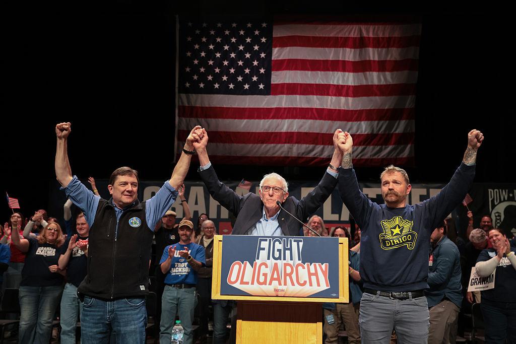 Sen. Bernie Sanders (I-Vt.) stands with Troy Jackson (L), then-candidate for governor of Maine, and then-Democratic U.S. Senate candidate Graham Platner during a “Fighting Oligarchy” tour stop at the Collins Center for the Arts on the University of Maine campus in Orono, Maine, on May 24, 2026. (Joe Raedle/Getty Images)
