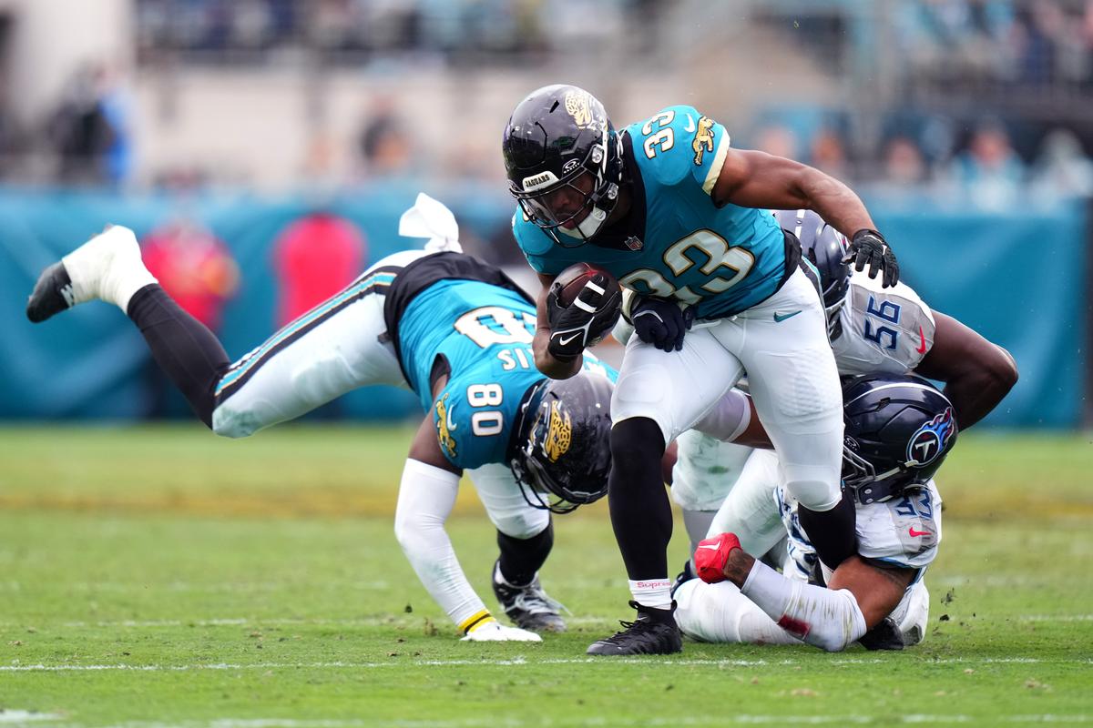 Bhayshul Tuten #33 of the Jacksonville Jaguars runs with the ball during the fourth quarter against the Tennessee Titans at EverBank Stadium in Jacksonville, Florida, on Jan. 4, 2026. (Rich Storry/Getty Images)
