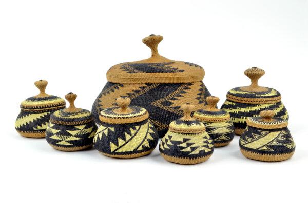 Lidded Baskets, 1920s–1930s, by Elizabeth Conrad Hickox (Wiyot/Karuk). Hazel, conifer roots, five-fingered fern, and porcupine quills dyed with wolf lichen. Largest basket: 5 3/4 inches tall by 7 1/2 inches diameter. Smallest basket: 2 1/4 inches tall by 2 3/4 inches diameter. Gift of the Dress family, Collection of Maryhill Museum of Art, Goldendale, Wash. (Courtesy of Museum of Art, Goldendale, Wash.)