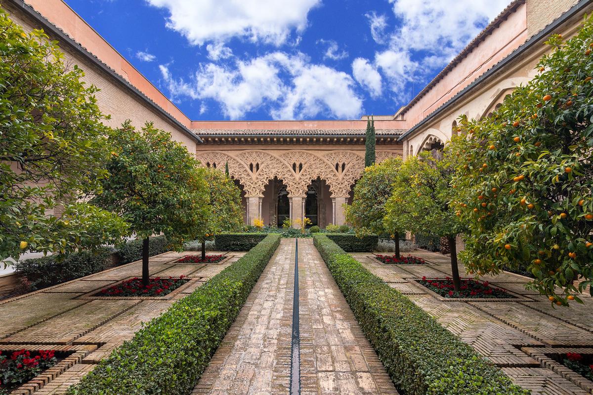 Visitors can explore the ornate courtyards, horseshoe arches, and medieval halls of Aljafería Palace, one of Spain's finest surviving examples of Islamic palace architecture. (OmbraEstudi/Shutterstock)