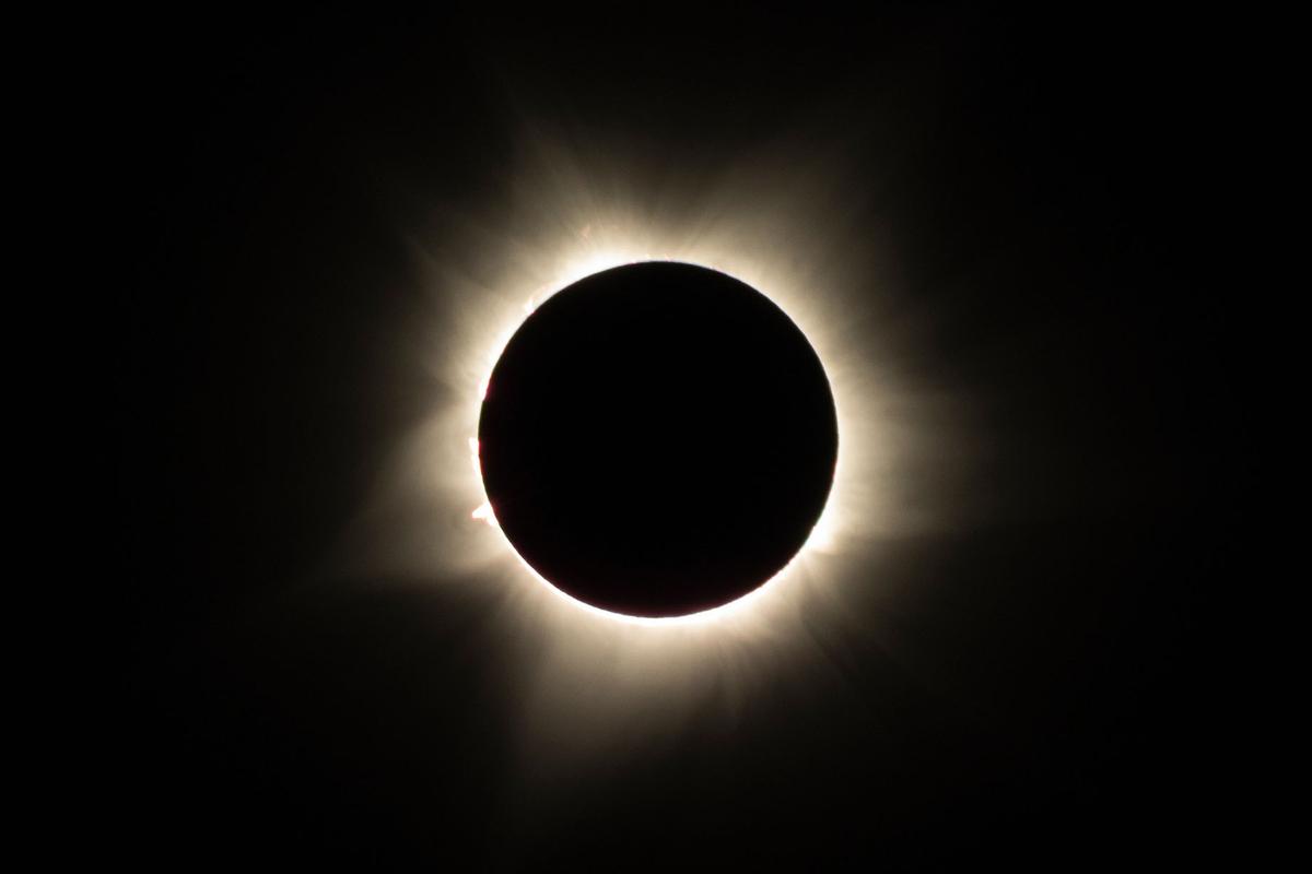 The sun’s spectacular atmosphere, called the corona, can only be seen in the moments of totality during a total solar eclipse. (Shutterstock/aeonWAVE)