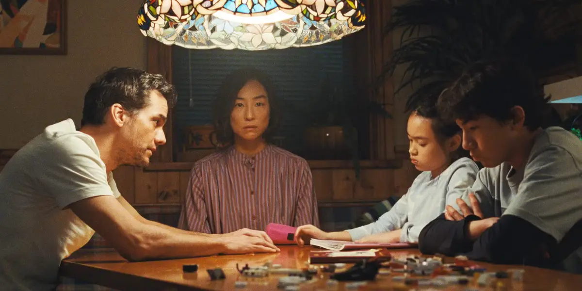 (L–R) Wagner Moura, Greta Lee, Riley Chung, and Noah Alexander Sosnowski play a family trapped in their house, in "The Last House." (Netflix)