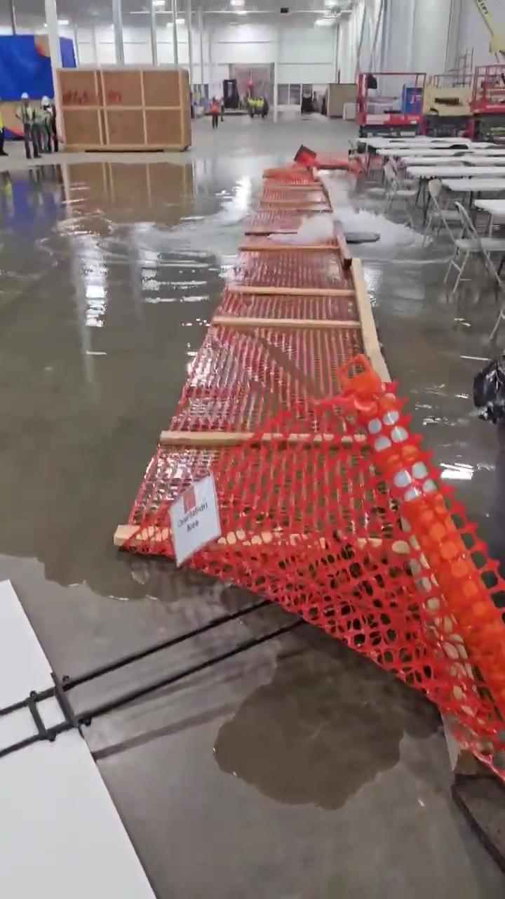 Water rises through a floor drain and spreads across a work area inside the Gotion facility in Manteno, Ill. Village Trustee Mike Barry said the incident followed a backup in the plant’s stormwater system. (Courtesy of Mike Barry)