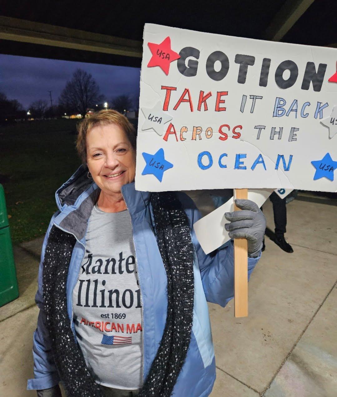 A resident protests the Gotion battery project before a Manteno Village Board meeting in November 2023. Opponents raised concerns about state subsidies, local control, and the company’s ties to the Chinese Communist Party. (Courtesy of Jeanne Ives)