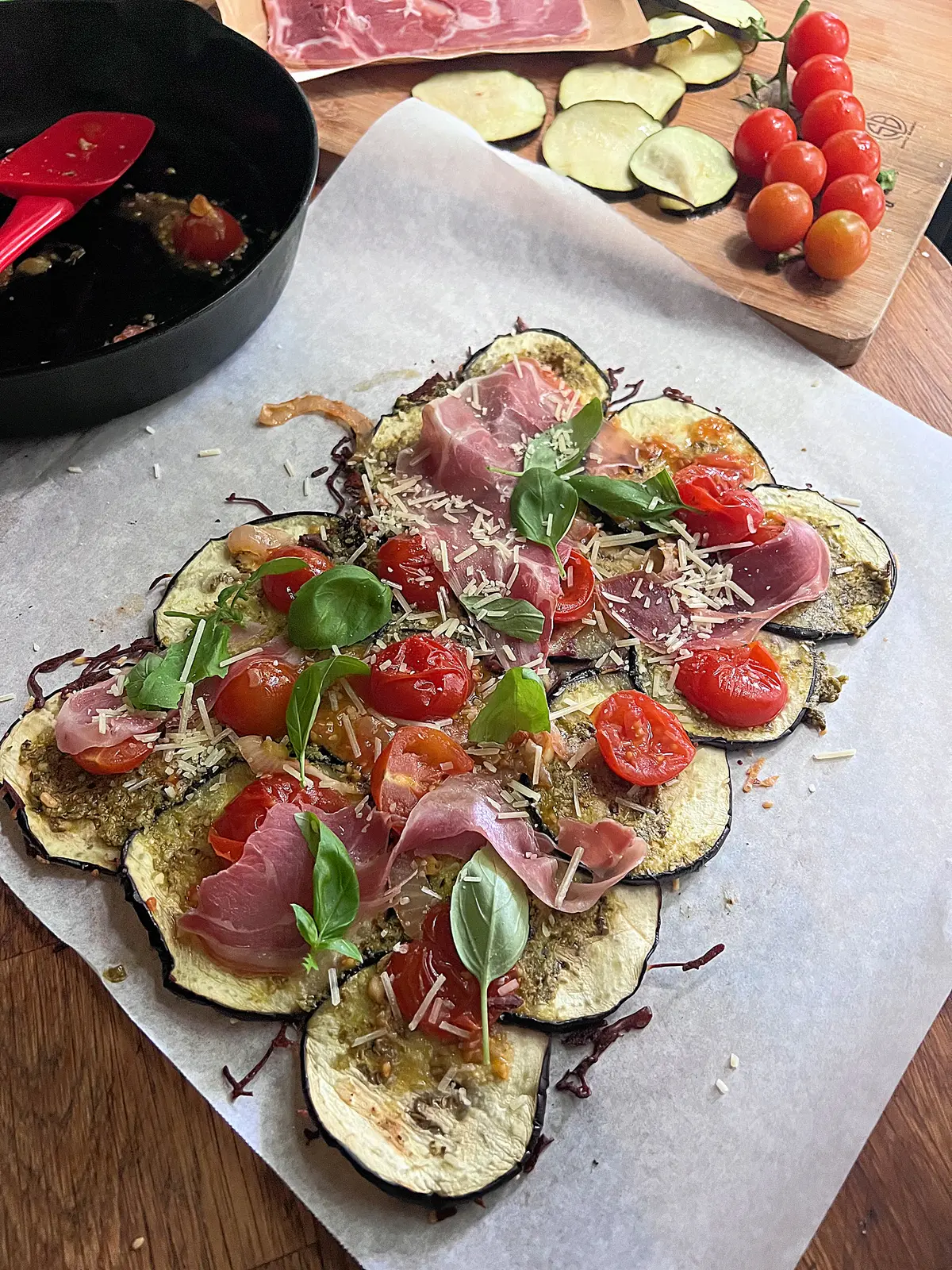 An eggplant "flatbread" can be filled with just about anything: tomatoes, onion, garlic, basil, and thin slices of jamón serrano. (Gretchen McKay/Pittsburgh Post-Gazette/TNS)
