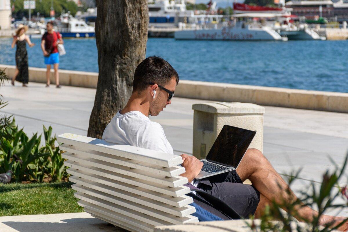 A man works on his laptop in Split, Croatia, in a file photo. (Wirestock Creators/ Shutterstock)