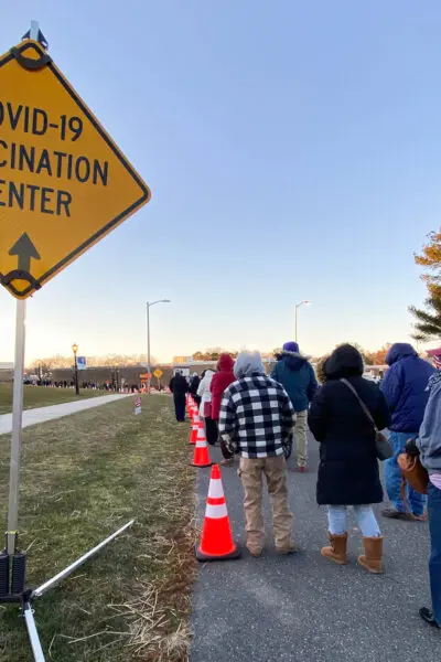 People waited in long lines to receive the COVID-19 vaccine. (Photo Spirit/Shutterstock)