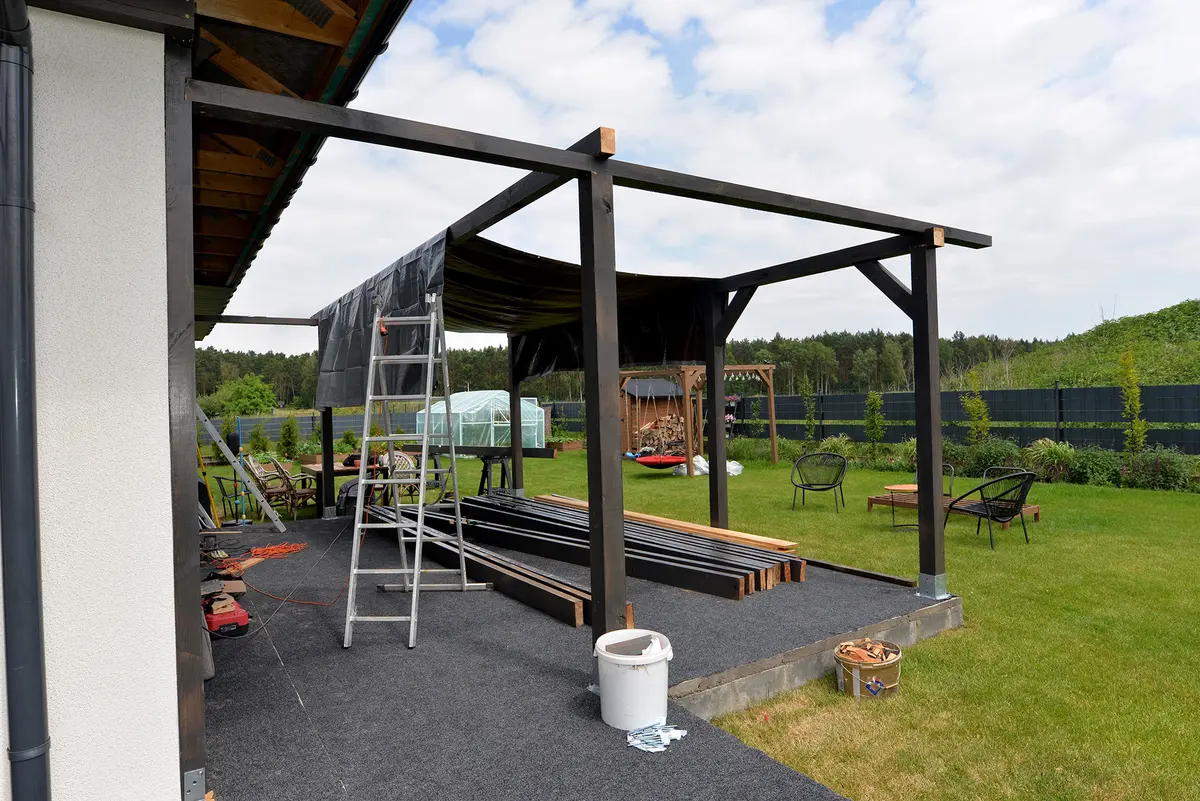 Attached pergolas can extend a home’s living space. (Kinek00/Shutterstock)