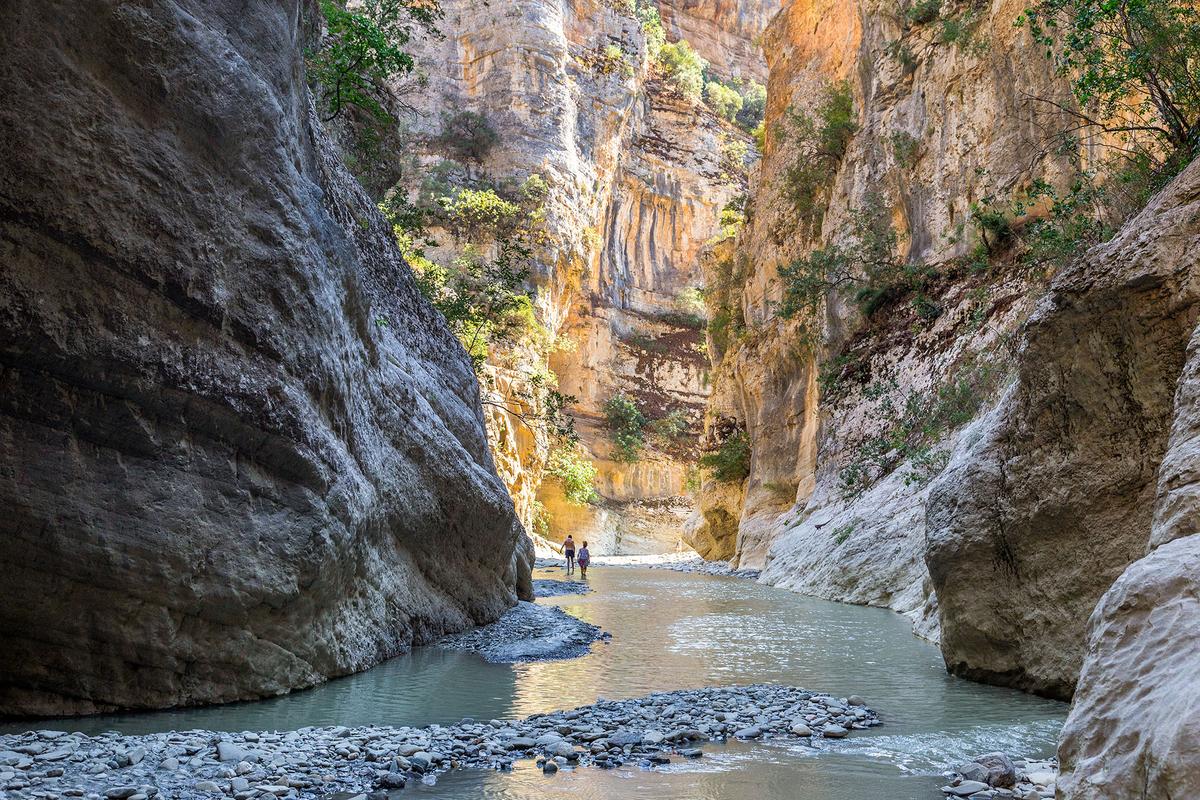 Vjosa River flows through Langarica Canyon, which lies near the thermal springs of Benje in southern Albania. In 2023, the Vjosa became the centerpiece of Europe’s first designated Wild River National Park. (alpinetrail/Shutterstock)