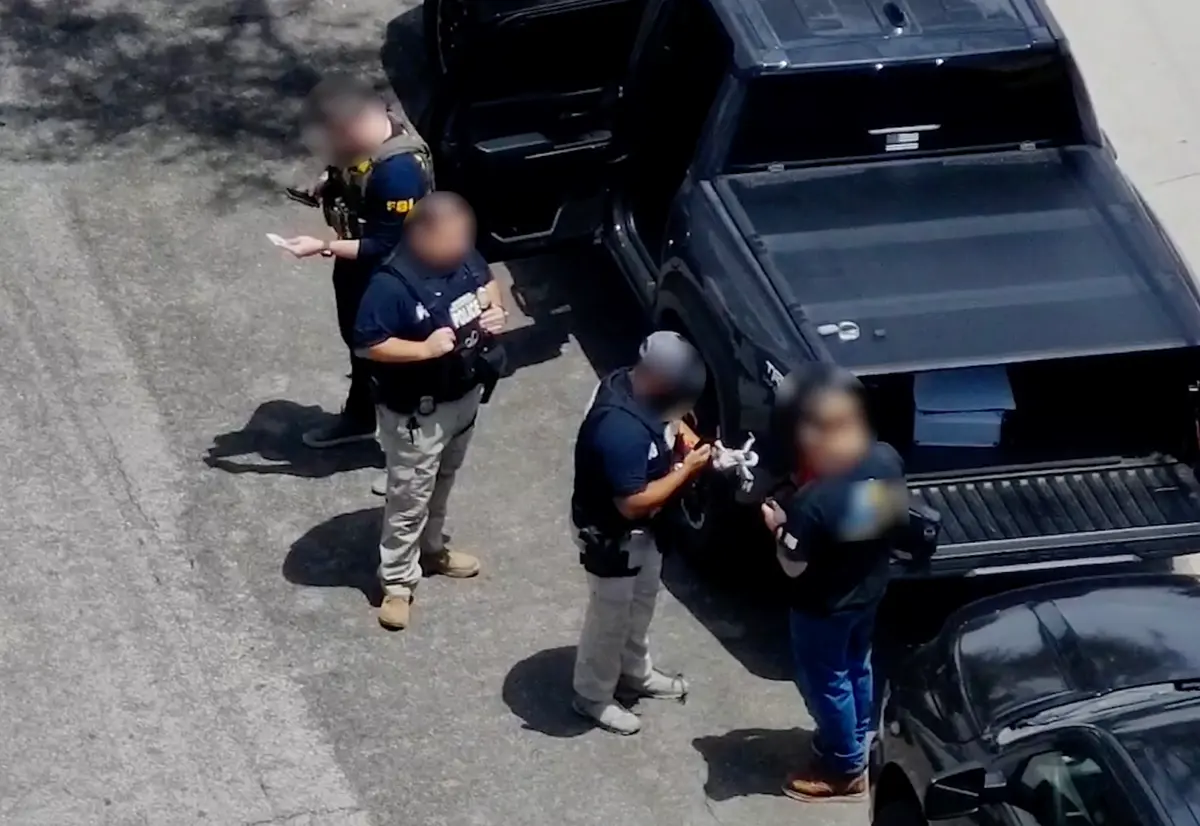FBI agents examine an illegally operated drone during the FIFA World Cup tournament. (FBI)