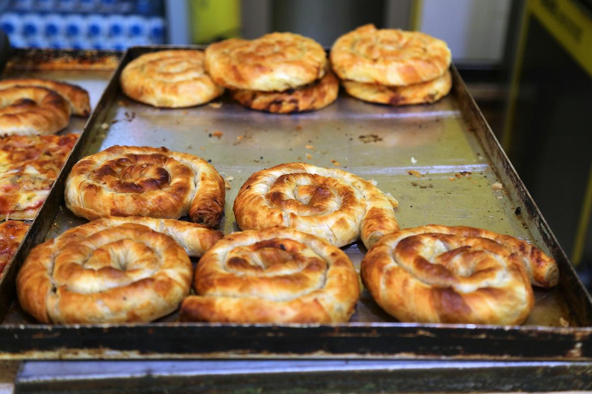 Byrek, a popular Albanian savory pastry, is made with thin layers of dough filled with ingredients like cheese, spinach, meat, or pumpkin. (Tupungato/Shutterstock)