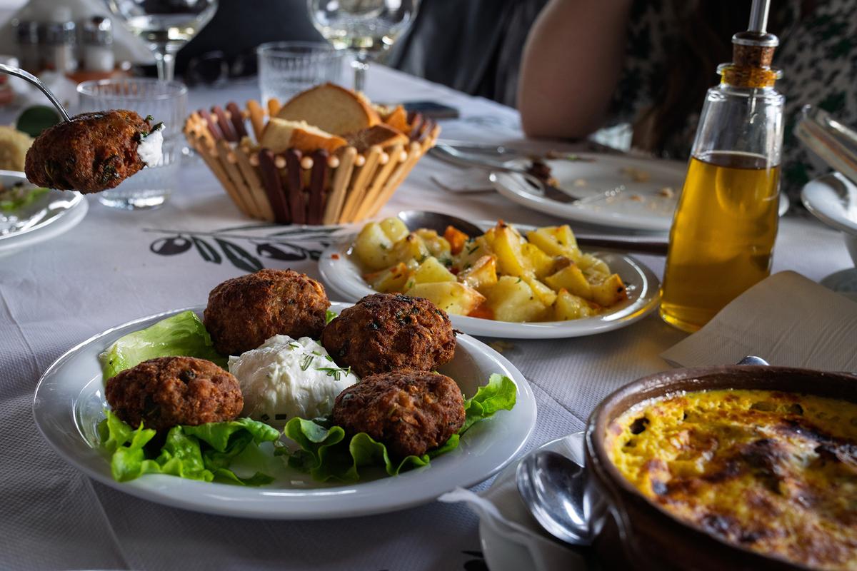Seasoned qofte meatballs are commonly flavored with onions, herbs, and spices before being grilled or pan-fried and served alongside fresh bread, grilled vegetables, yogurt, or salad.(Nemir2000/Shutterstock)