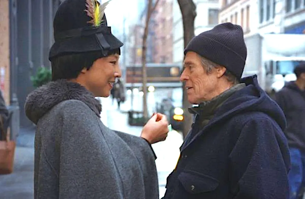Gloria (Greta Lee) and Ed Saxberger (Willem Dafoe) find themselves in budding relationship, In "Late Fame." (Magnolia Pictures)