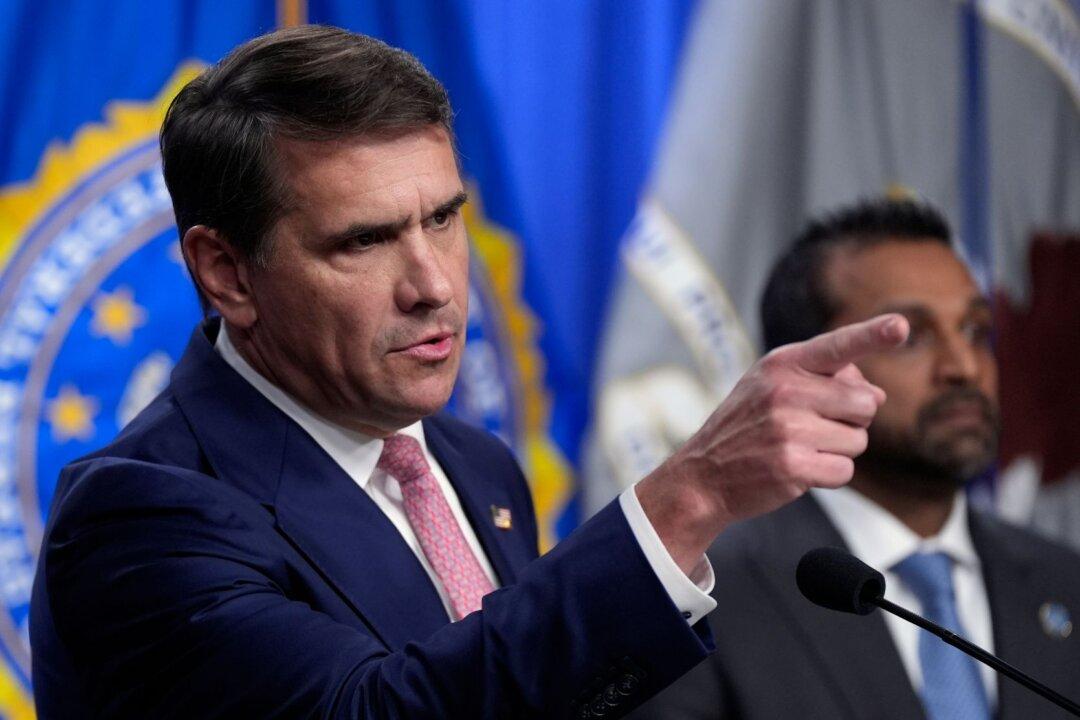 DOJ Seeks Removal of Afghan Woman Accused of Aiding Terror Plot